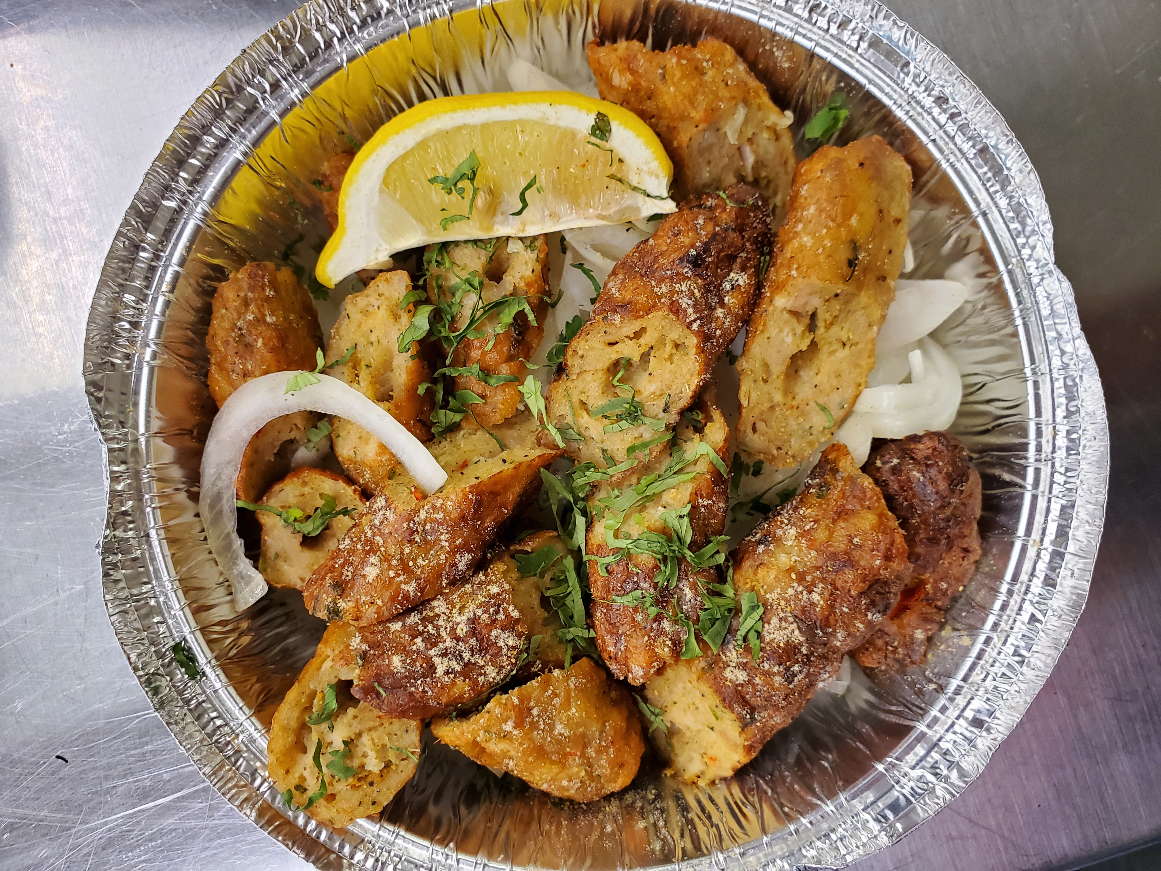 Chicken Sheesh Kabab — Handcrafted Premium minced chicken blended with the chef's — at Himalayan Restaurant