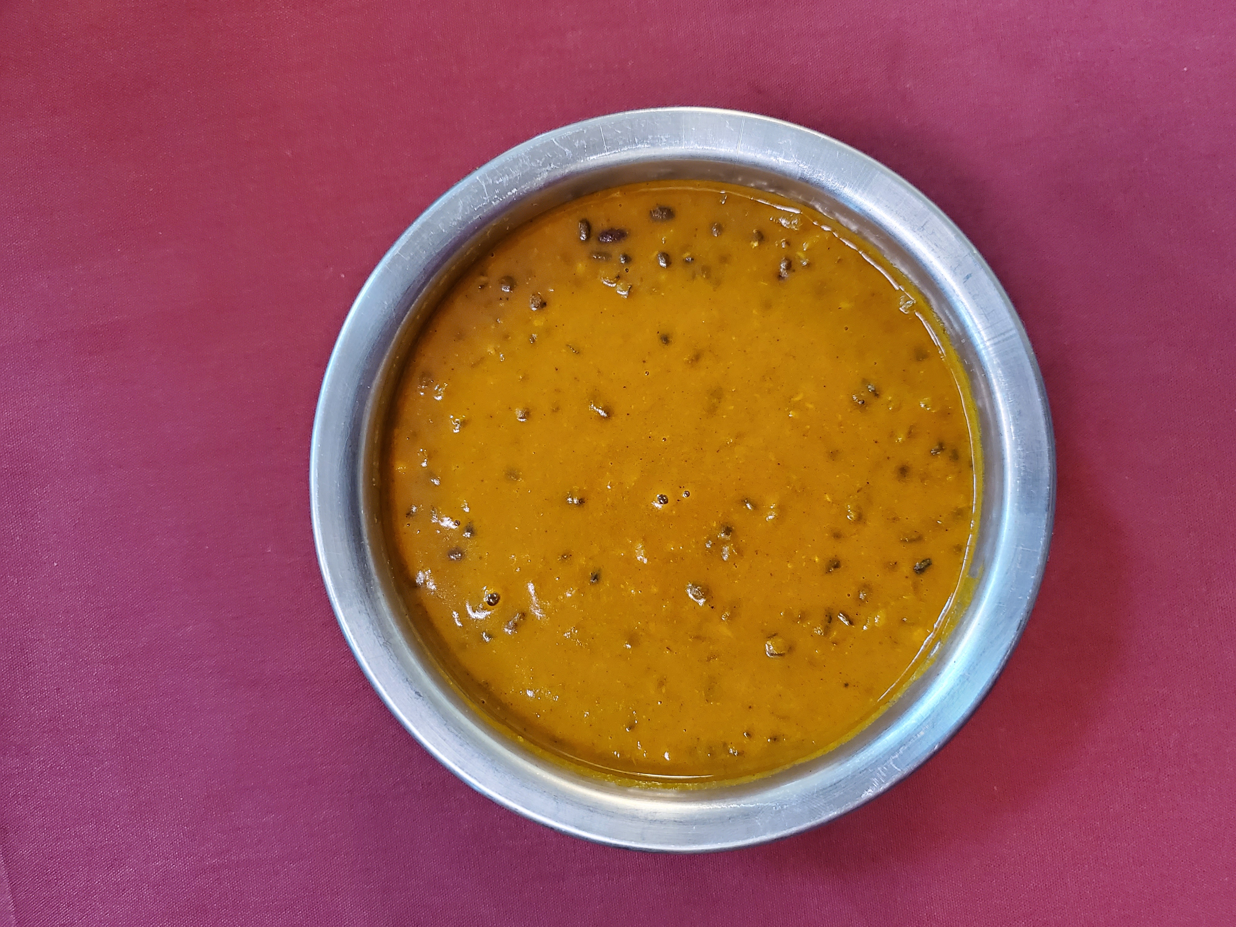 Daal Makhani — Whole black lentils slow-simmered until tender, seasoned with — at Himalayan Restaurant
