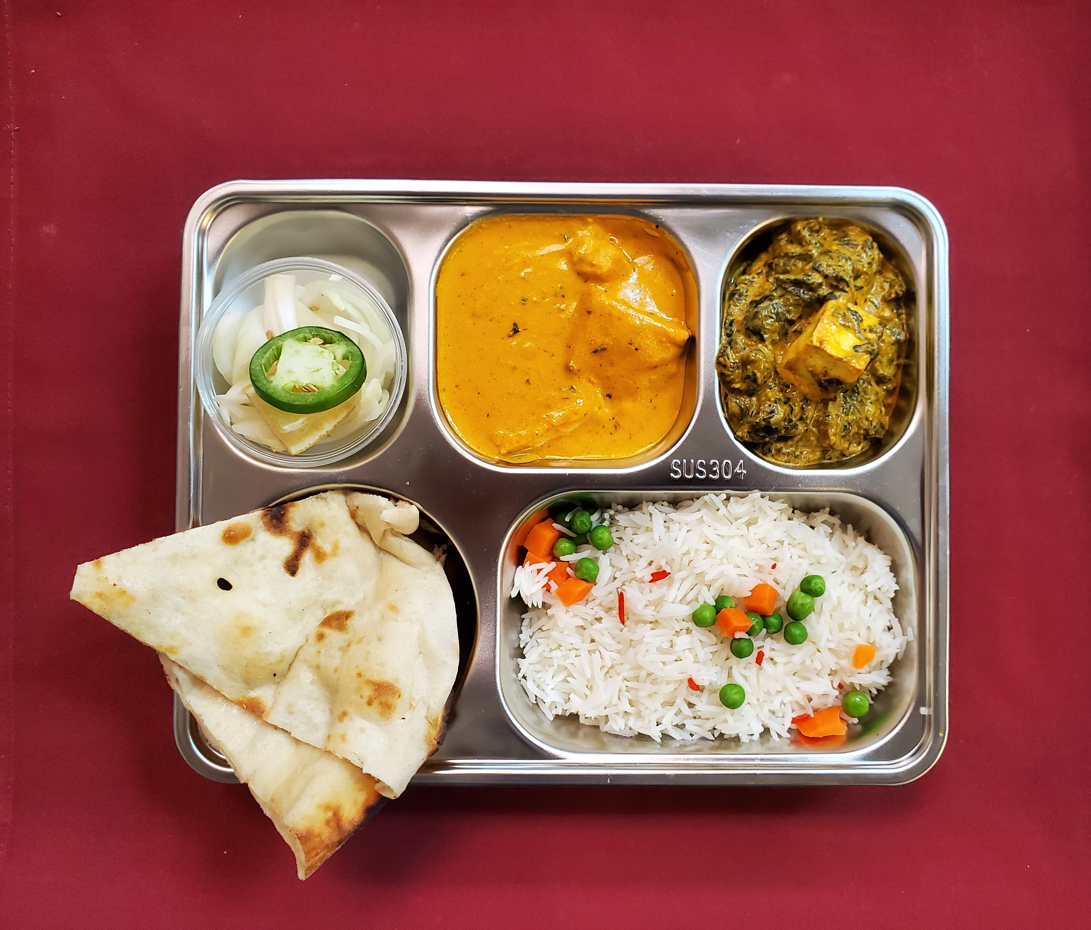 Express Grand Plate — Our 6-item Lunch Express — 3 entrees, 2 sides, and a sweet Gulab Jamun, at Himalayan Restaurant