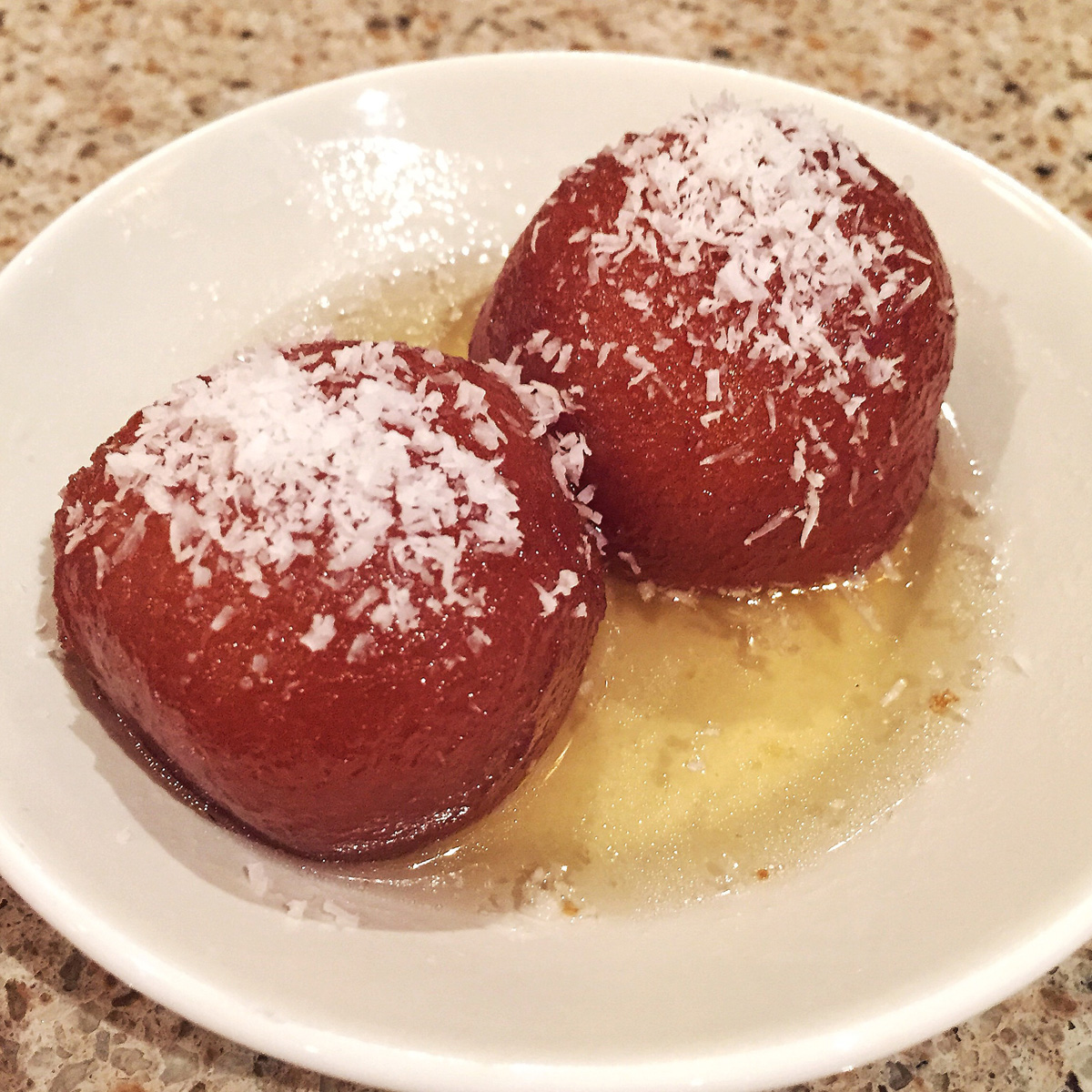 Gulab Jamun — Golden fried balls made from powdered milk, soaked in sweet — at Himalayan Restaurant
