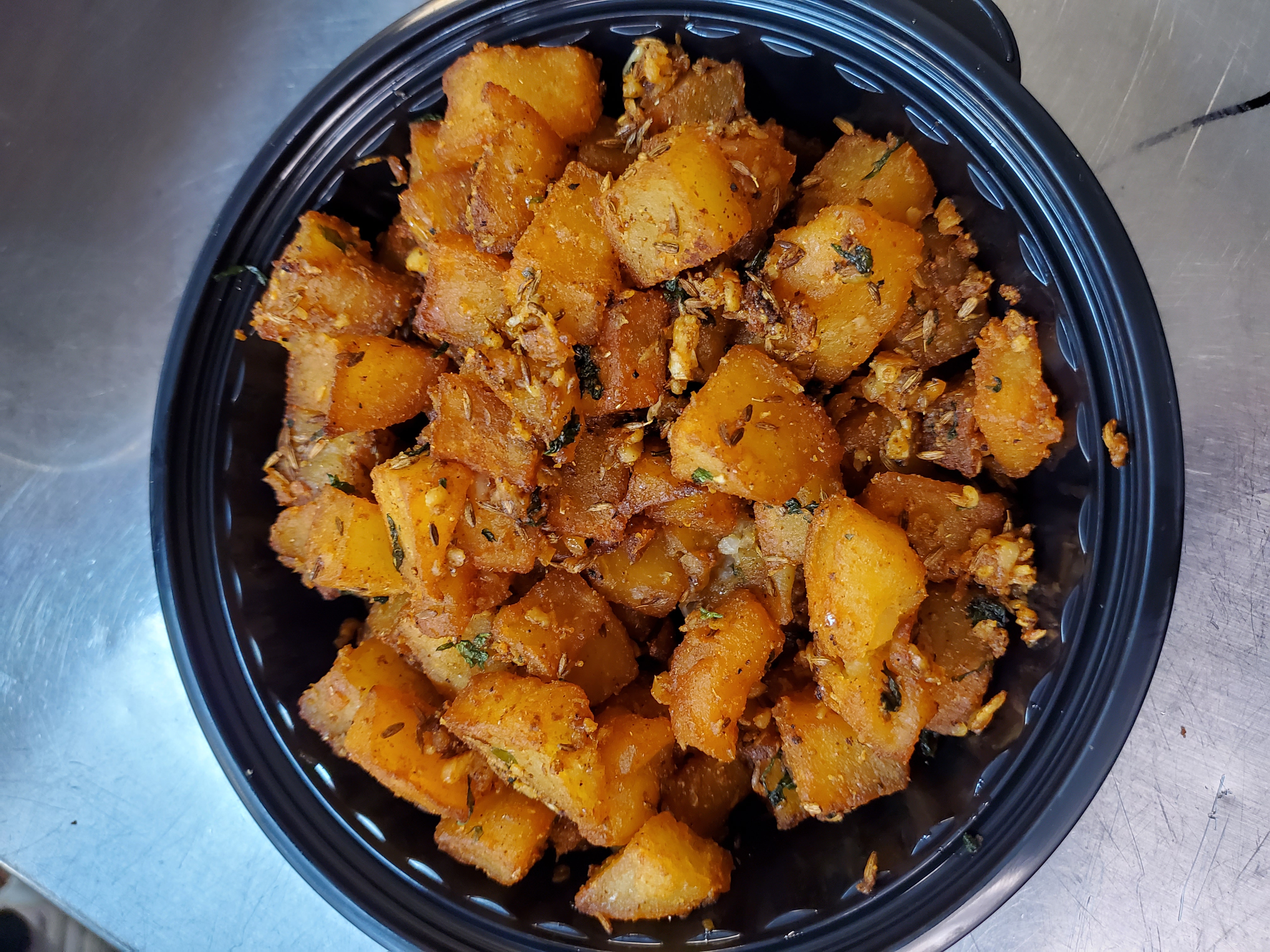 Jeera Aloo — Potatoes sautéed with cumin seed and mild spices, at Himalayan Restaurant