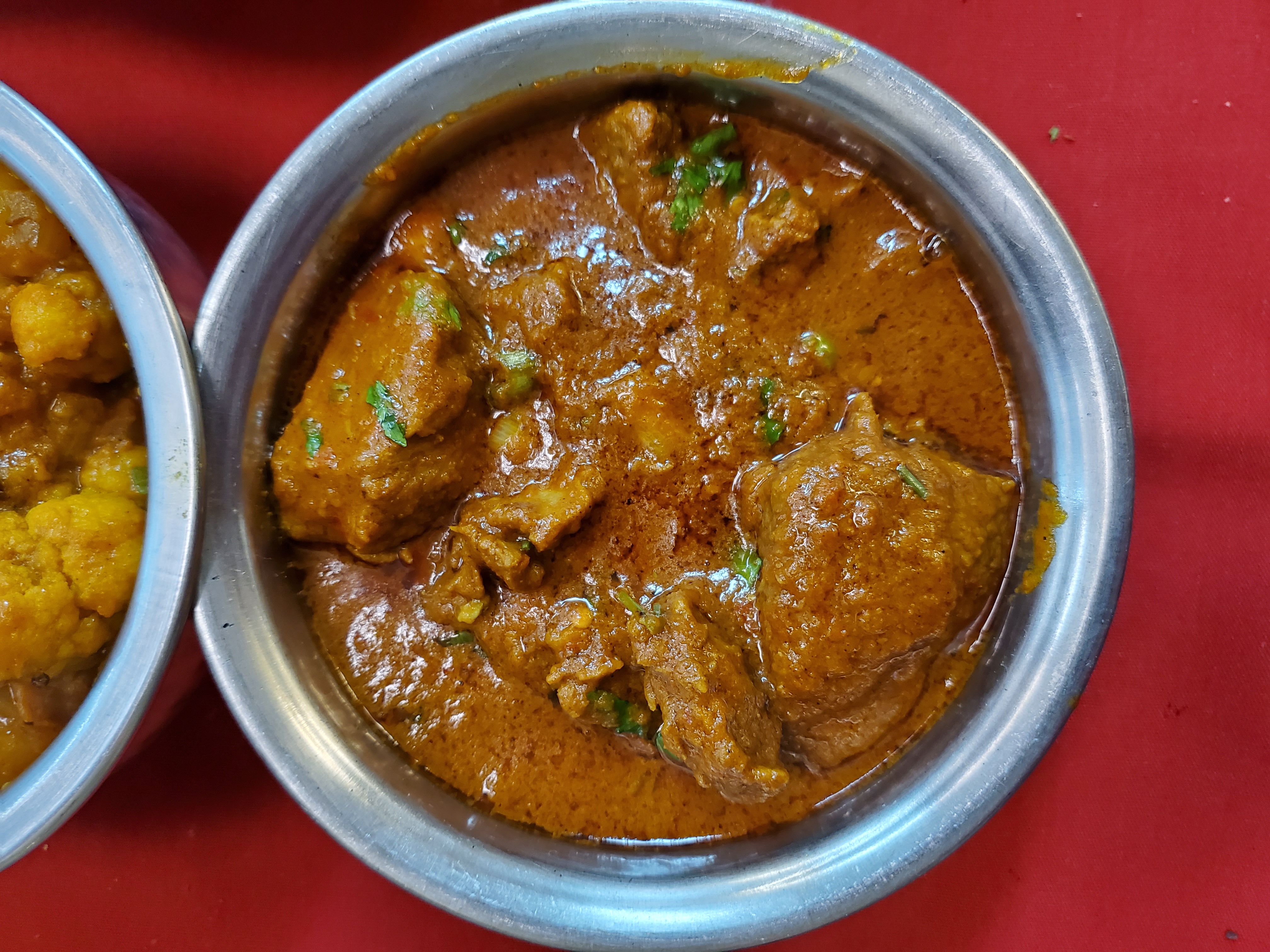 Lamb Curry — Tender lamb pieces simmered in onion and tomato sauce with — at Himalayan Restaurant