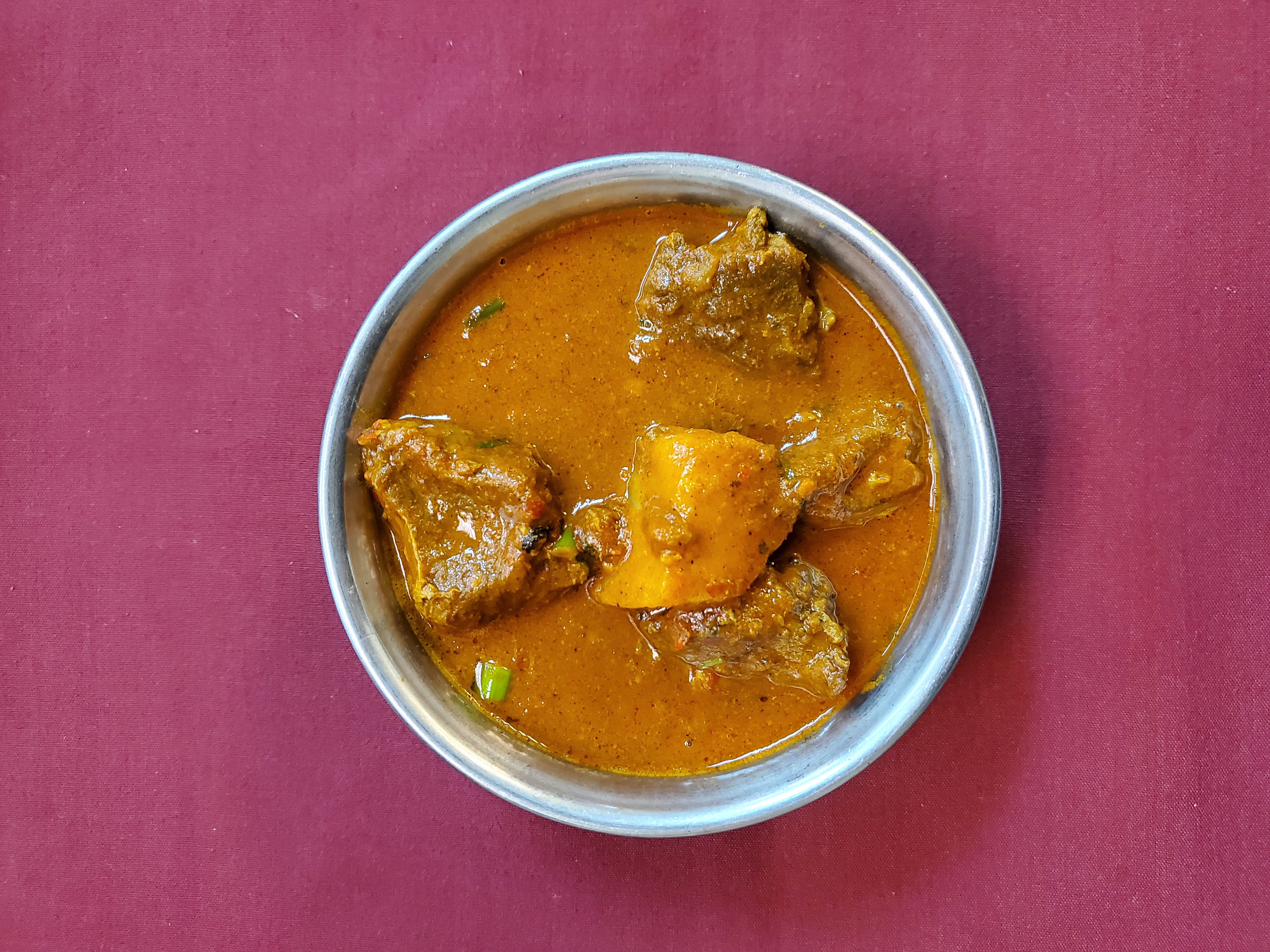 Lamb Vindaloo — Tender lamb and potato cooked in a Goan-style tangy hot curry sauce, at Himalayan Restaurant