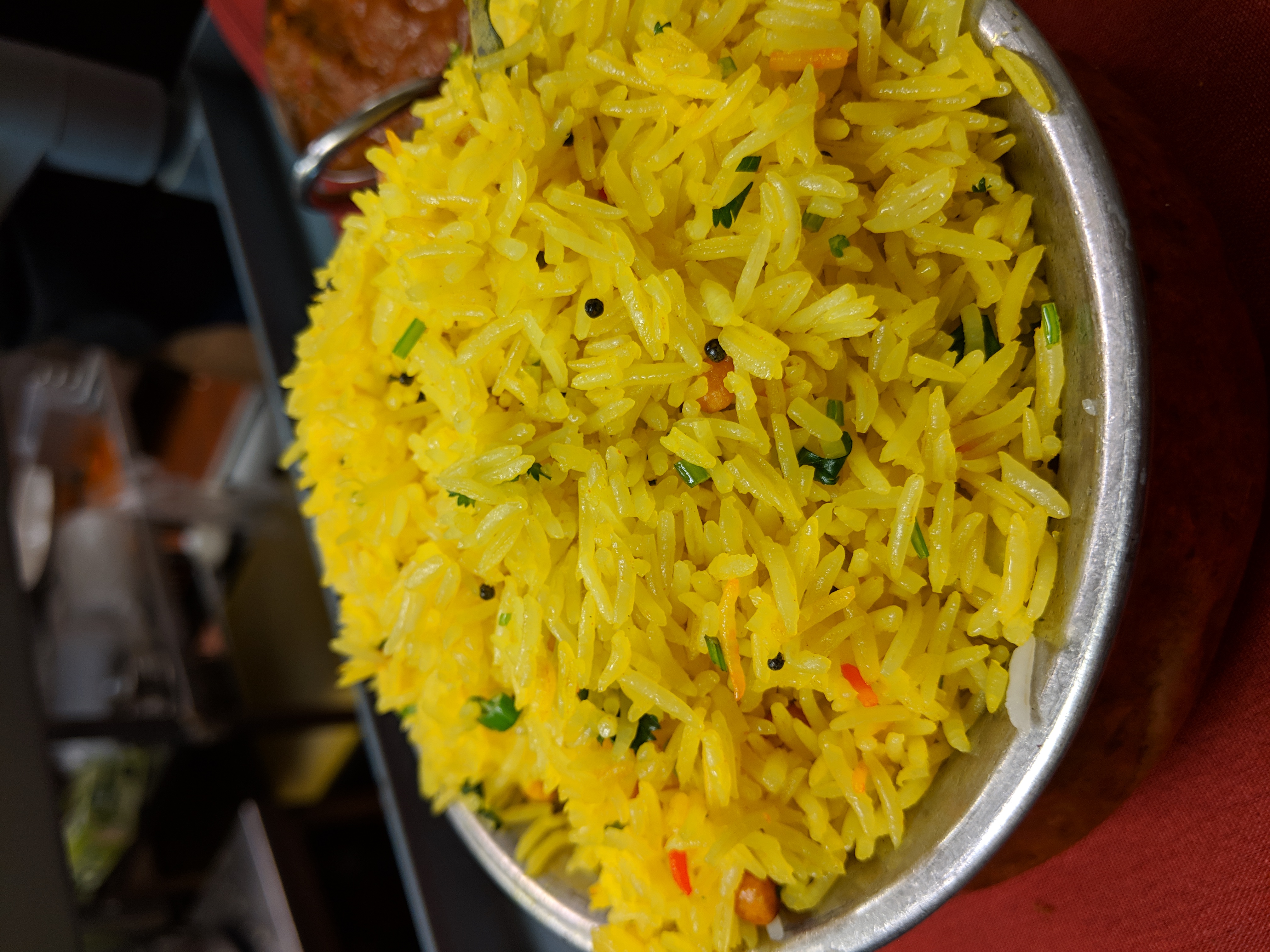 Lemon Rice — Basmati rice cooked with lemon juice, curry leaves, and sesame seeds, at Himalayan Restaurant