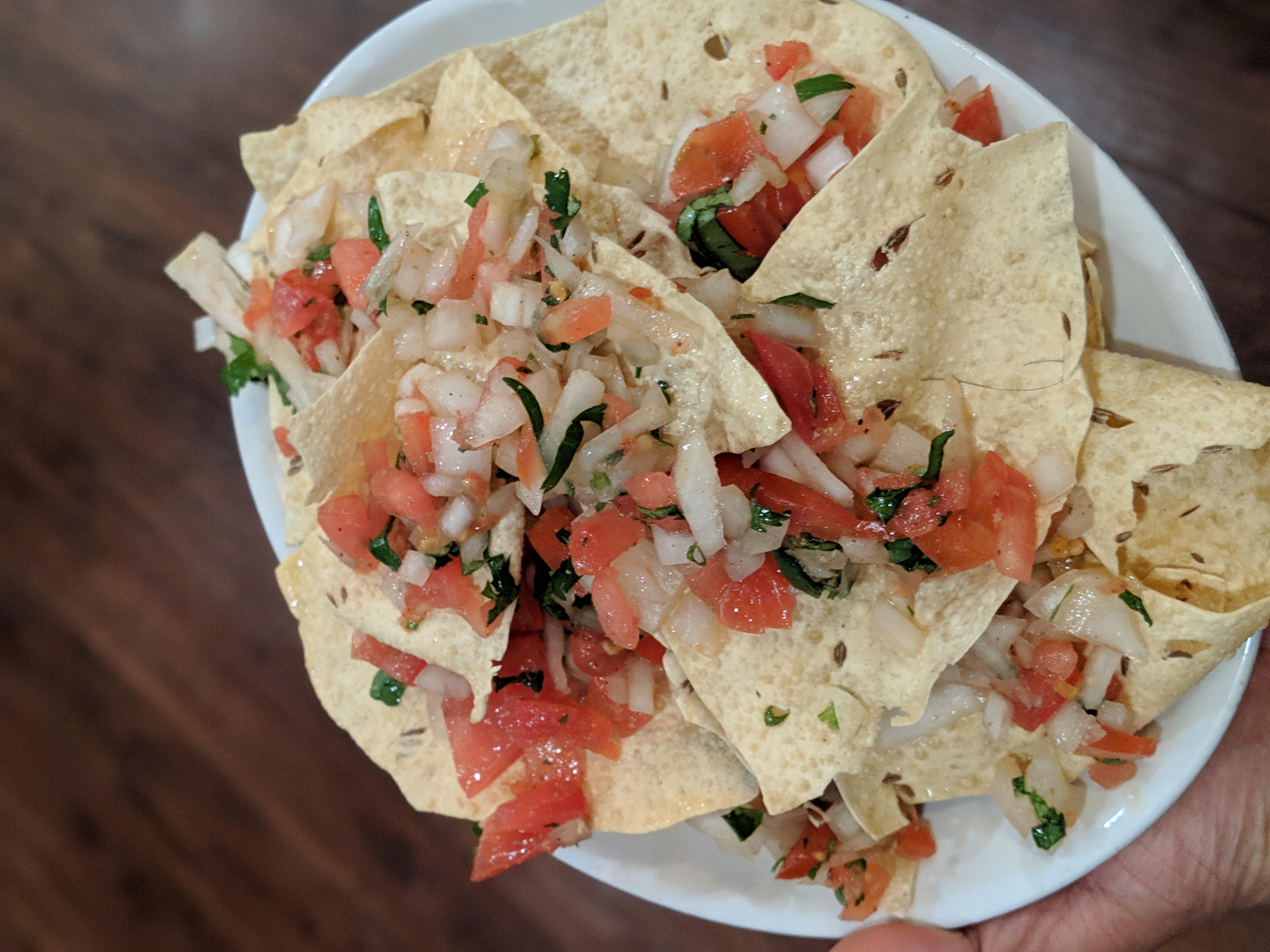 Masala Papad — Lentil crackers with diced onion, chili, tomato, and cilantro, at Himalayan Restaurant