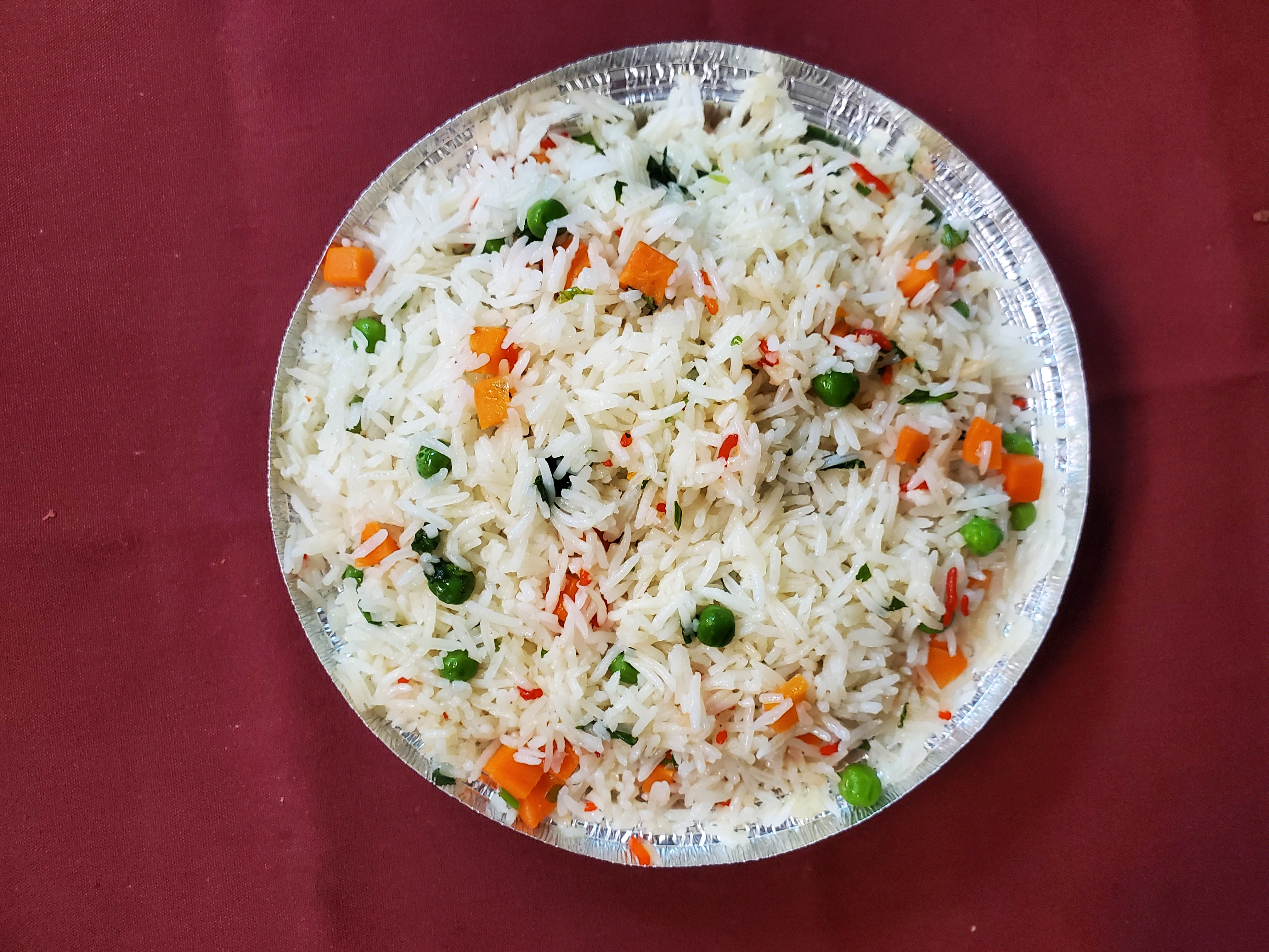 Peas Pulav — Basmati rice cooked with green peas and aromatic flavors, at Himalayan Restaurant