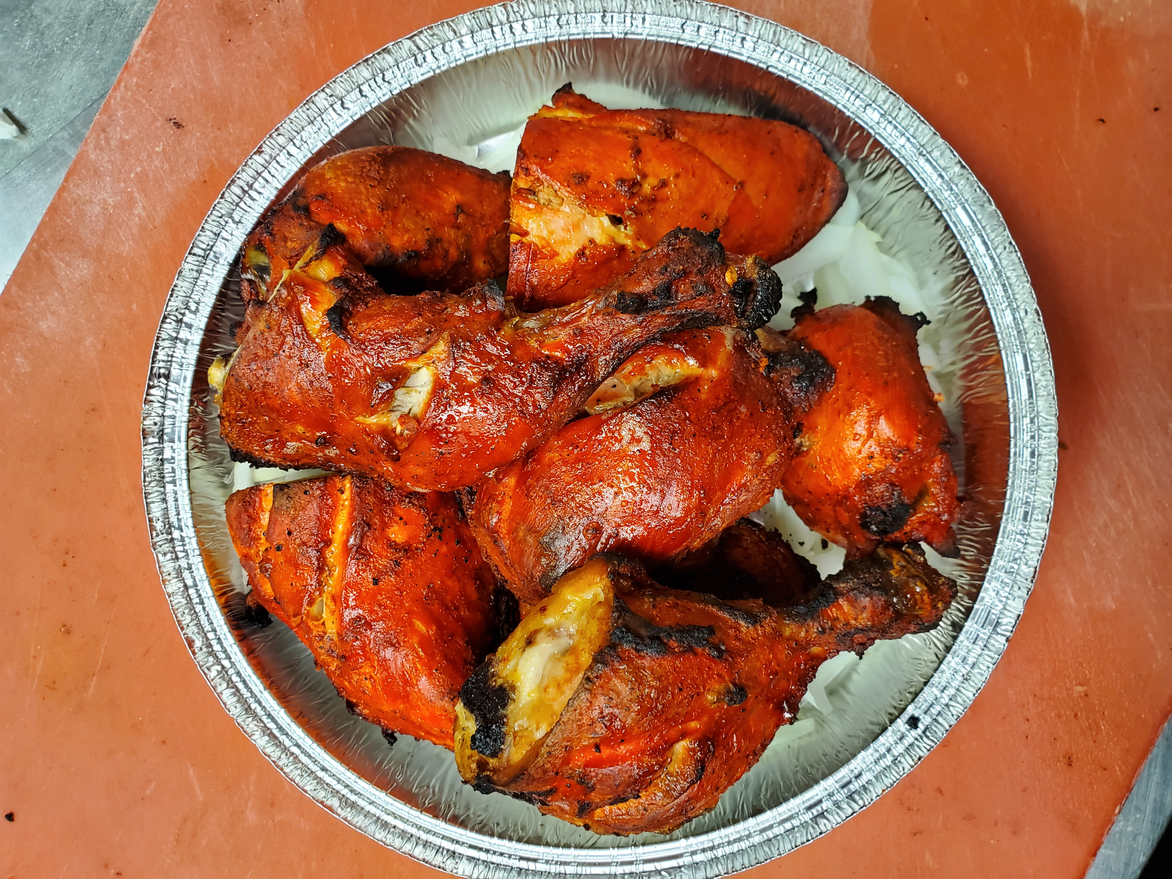 Tandoori Chicken — Whole chicken marinated in yogurt with ginger, garlic, and — at Himalayan Restaurant