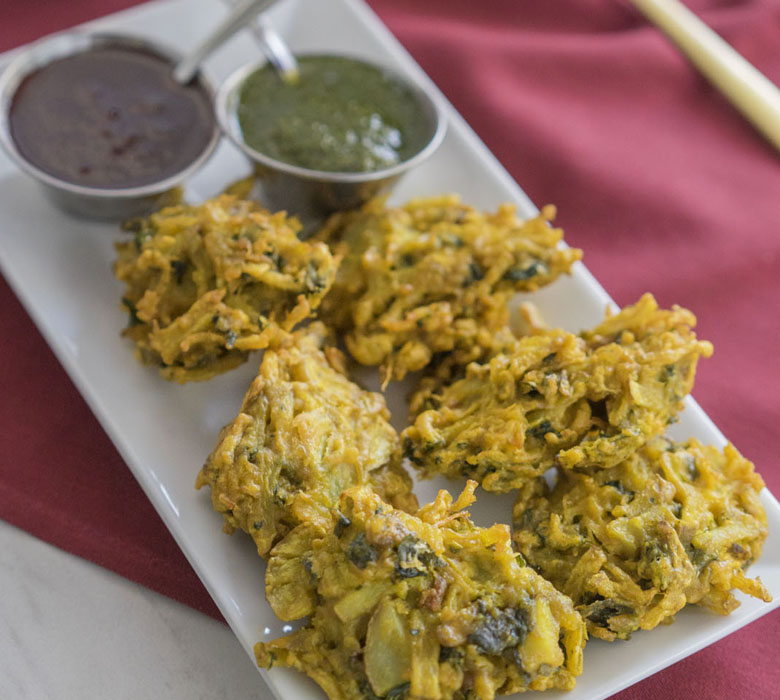 Vegetable Pakora — Savory vegetable fritters, mildly spiced, dipped in seasoned — at Himalayan Restaurant