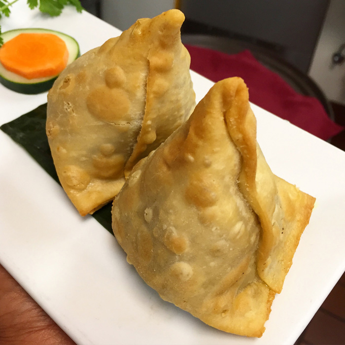 Vegetable Samosa — Crispy pastry stuffed with spiced potatoes and green peas — at Himalayan Restaurant